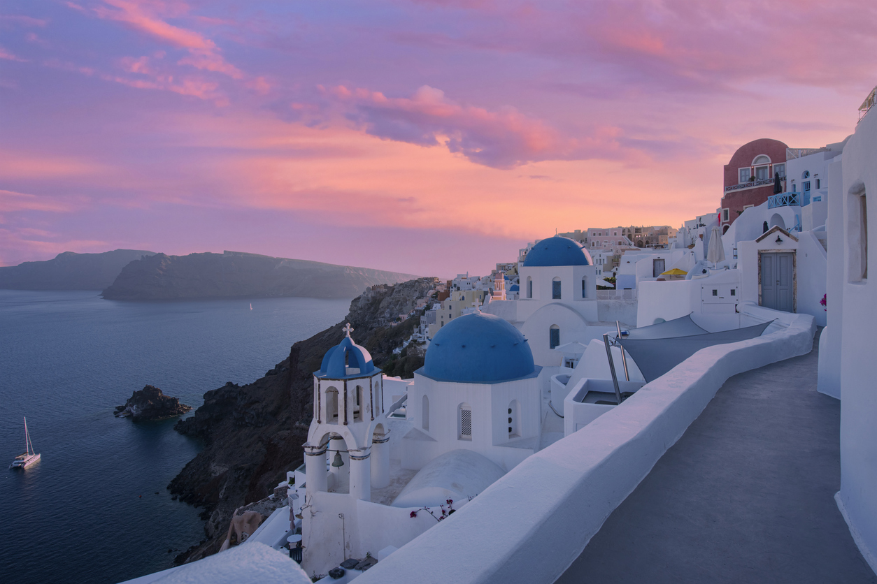 Classical sunset view of the picturesque old town of Oia village on Santorini island, Greece