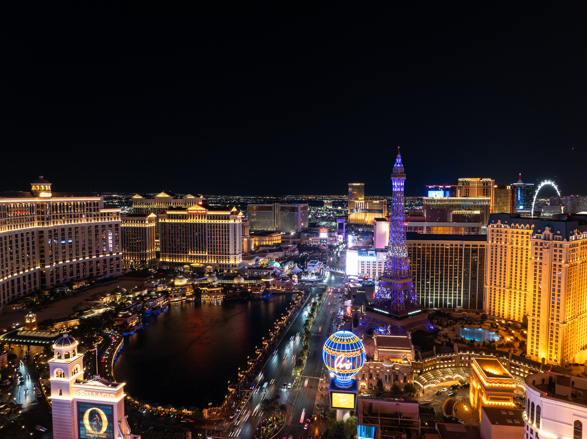 Aerial shot of illuminated hotels and resorts on the Strip in Las Vegas, Nevada at night.